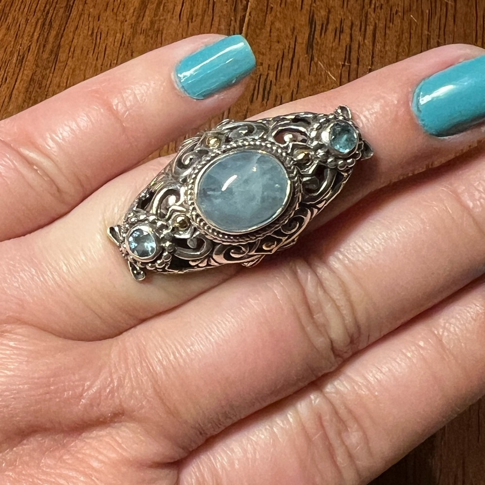 .925 Sarda ring with 18k gold detail. Aquamarine and blue topaz gemstones.